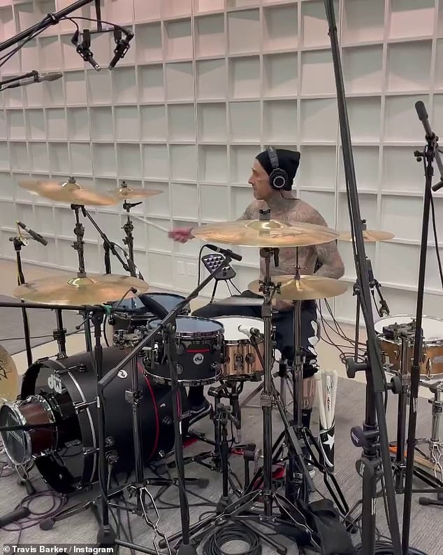 Busy: On Friday, Travis also took to Instagram to share videos of himself playing the drums while giving his fans a glimpse into the recording process for the band's ninth album