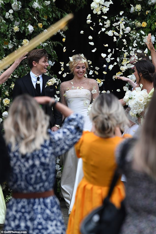 Just married!  Their wedding was then called off several times due to Covid and Pikie, and Oliver finally tied the knot last June at Ely Cathedral