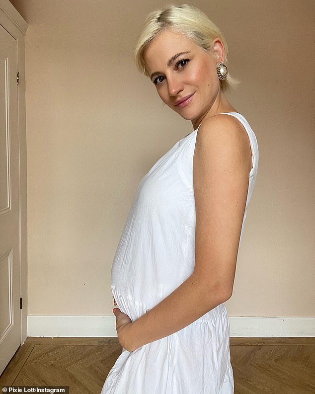 Exciting: Pixie hinted she wasn't far off her due date in August as she shared a snap of herself holding her baby bump with the caption 'not long' and now she's welcomed her little one