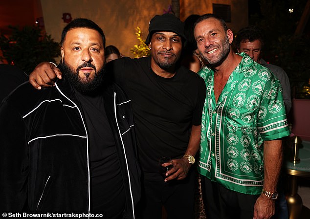 Busy night: Mike Gardne (centre) opted for a black top as he joined DJ and David