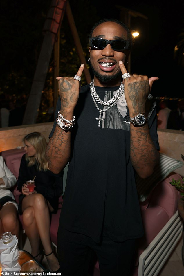 Lux: Quavo showed off his diamond grillz