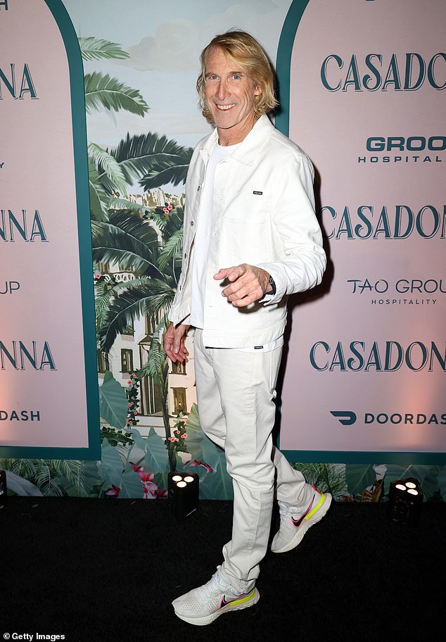 Slick: Michael Bay wore a cream jacket with matching pants