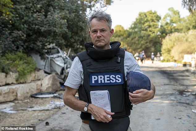 Sam Greenhill, chief reporter for the Daily Mail, pictured at the site of Kibbutz Be'eri, 2.5 miles from the Gaza border, and was attacked on Saturday, October 7.