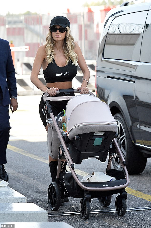 Comfy: Diletta wore a black sports bra with matching bike shorts and chunky knee-high boots