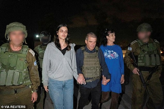 An image of the two being returned to Israel was shared by authorities in the area, showing the pair surrounded by armed soldiers