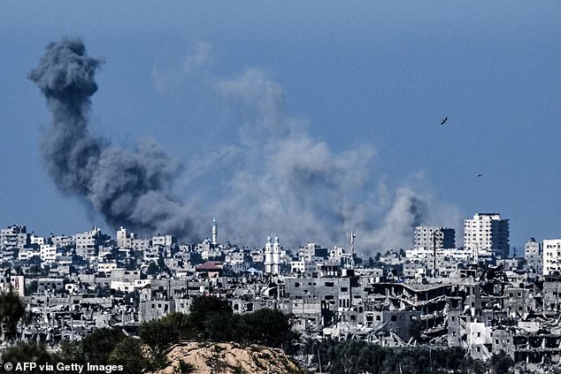 A photo taken from the Israeli side of the border with the Gaza Strip shows smoke rising over the northwestern part of the Palestinian enclave during an Israeli bombardment on October 21, 2023