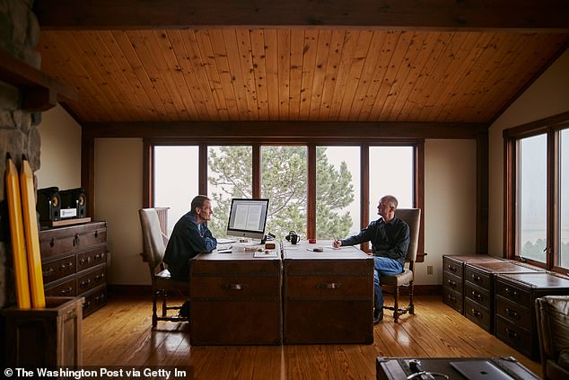 The brothers' joint study, where they work together creatively, has wooden beams, wooden plank floors and ceilings and large windows overlooking the trees and surrounding fields