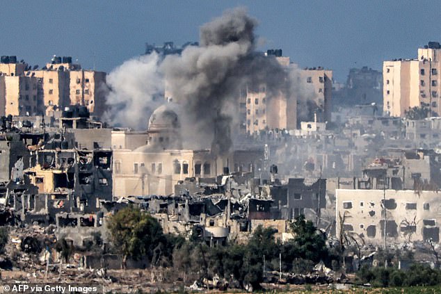 This photo taken from the southern city of Sderot in Israel shows a plume of smoke erupting during the Israeli bombardment in the northern Gaza Strip on October 19, 2023