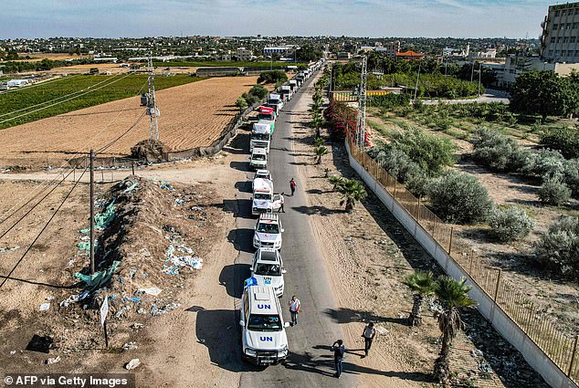 This aerial view shows humanitarian aid trucks arriving from Egypt after crossing the Rafah border crossing and arriving at a storage facility in Khan Yunis in the southern Gaza Strip on October 21, 2023