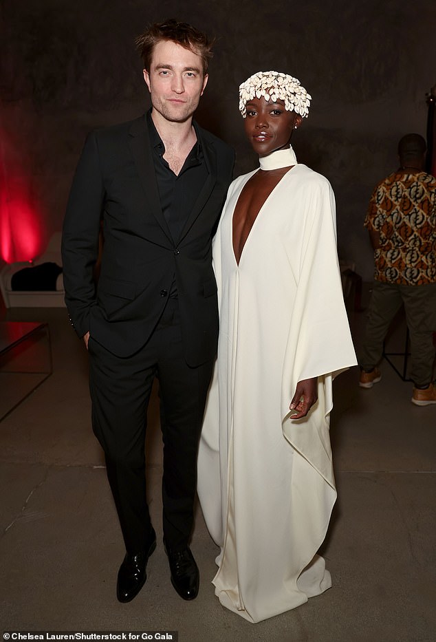 Star-studded: Lupita posed with The Batman star Robert Pattinson