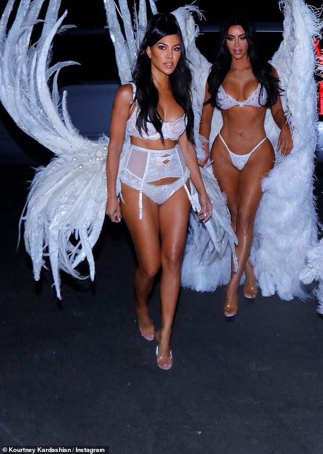 Angels or devils: In one of the photos Kourtney shared, the sister duo posed in lingerie and angel wings