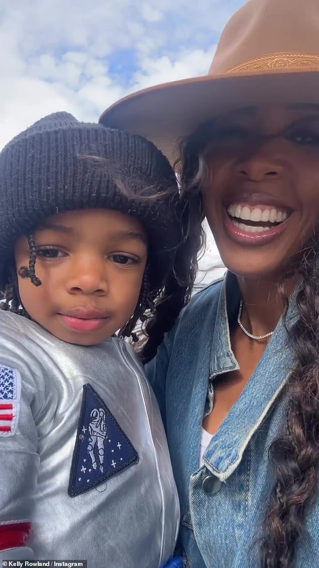 Cute;  Rowland tried to get Noah, dressed in his silver astronaut suit, to talk as the camera rolled, but he became shy and turned to hug his mother