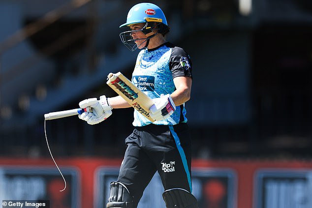 The Heat star holds up her broken bat after hitting a maximum on Sunday