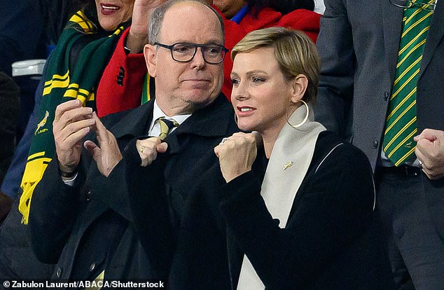 Charlene (pictured, right) was joined by her husband Prince Albert (pictured, left) as she watched the rugby in Paris