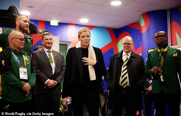 Prince Albert appeared to look admiringly at his wife as she interacted with players in the dressing room