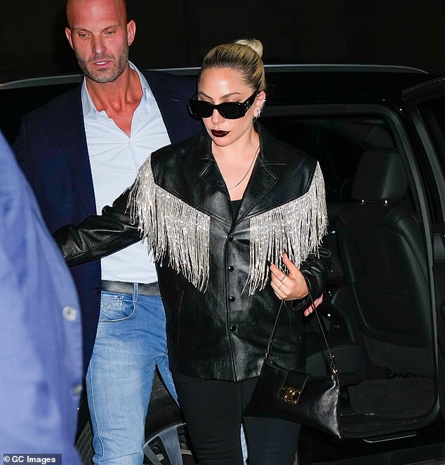 Chic: Lady Gaga wore her blonde locks in a neat bun and opted for gothic makeup