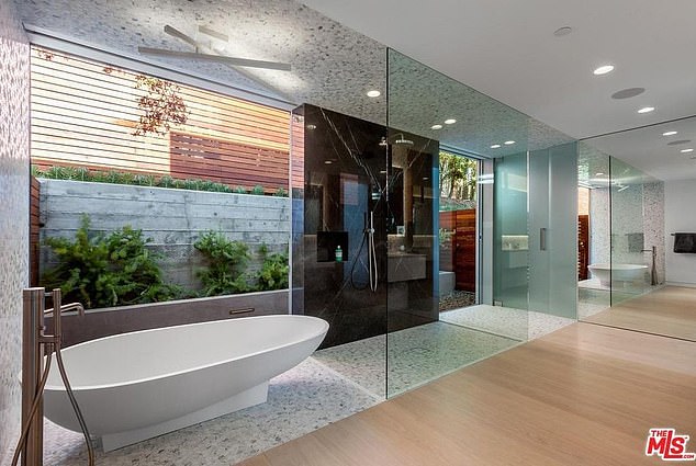 A Japanese shower room is a bathroom in which the shower and bath are combined into one glass-enclosed space.  But experts say they are difficult to clean