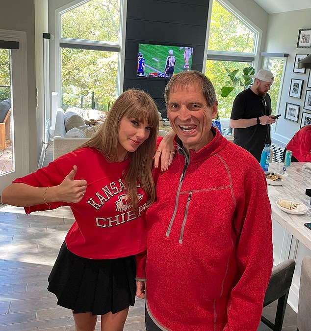 Earlier in the day, Swift was seen getting ready for her latest outing to Arrowhead at Travis Kelce's house, enjoying lunch with the likes of NFL legend Bernie Kosar (pictured)
