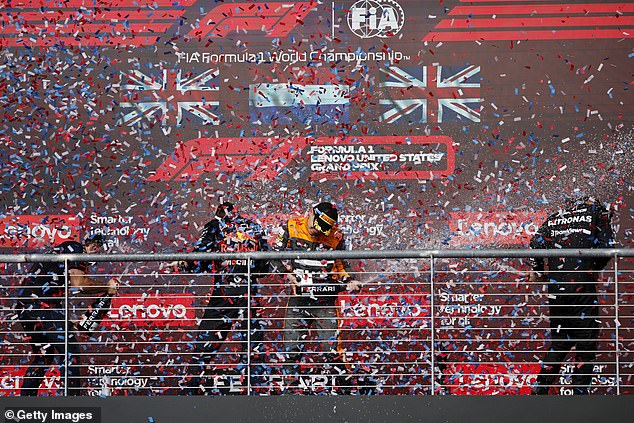 The three podium finishers enjoyed it while drinking champagne after the race