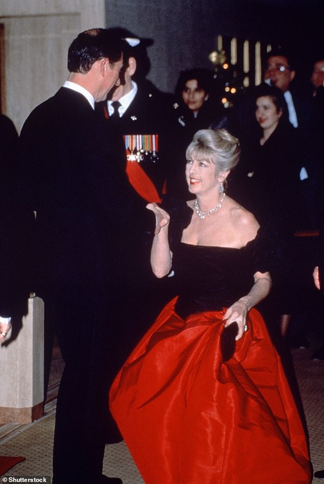 Lady Tryon bows to the Prince of Wales at a charity gala in 1990