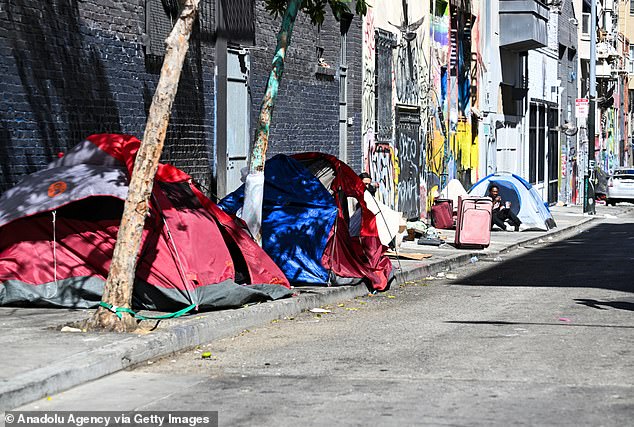 The department that addresses homelessness, a major problem in the city's core, faces $9 million in budget cuts (Photo: A homeless encampment in the Tenderloin District on August 28)