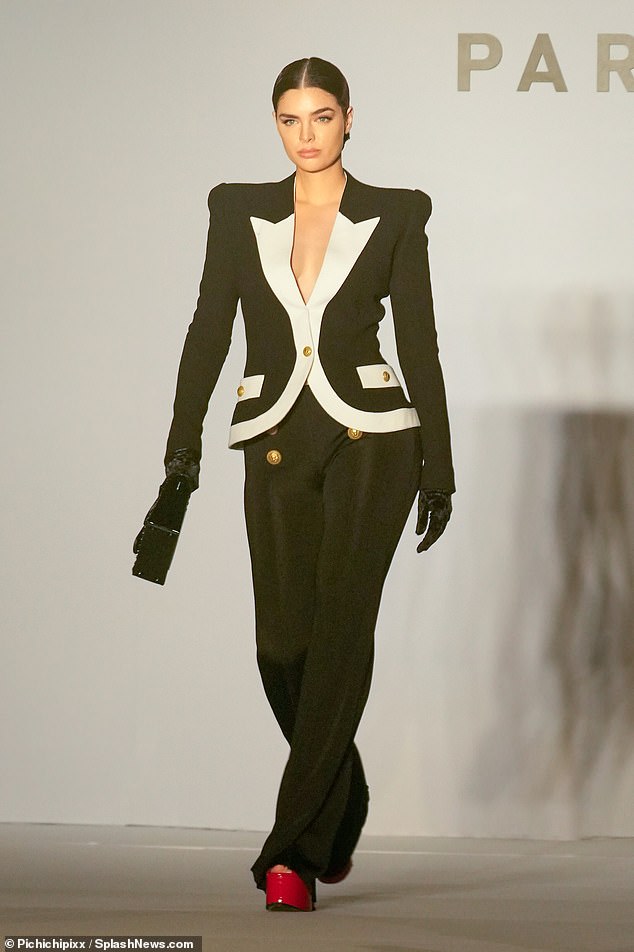 Incredible figure: During the runway show, she was also spotted modeling a chic black and white blazer with high-waisted skintight trousers