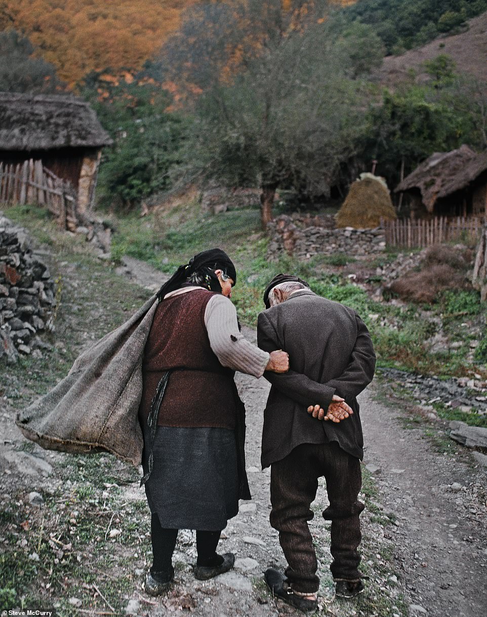 In this intimate photo from 1989, an elderly couple returns home after working in their corn fields in Gostivar, Macedonia