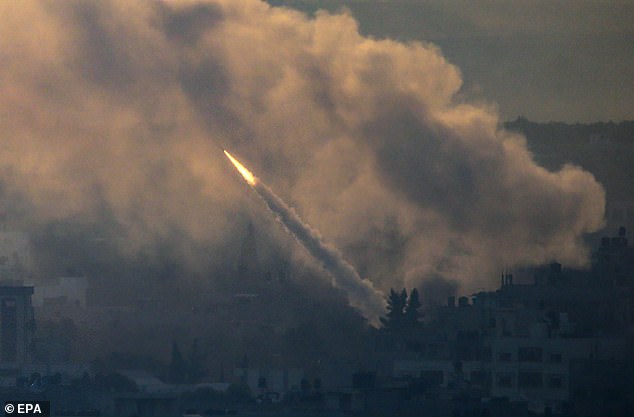 A rocket is launched from the Gaza Strip towards Israel by militants from the Ezz Al-Din Al Qassam militia, the military wing of the Hamas movement