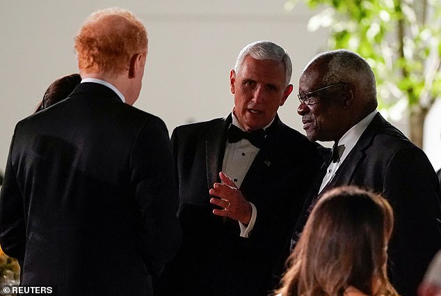 Pratt speaks with then-US Vice President Mike Pence and Supreme Court Justice Clarence Thomas, pictured at the White House in September 2019