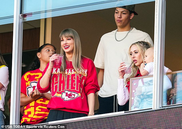 Taylor's fans were shocked to see Mahomes (back) so close to the pop superstar on Sunday