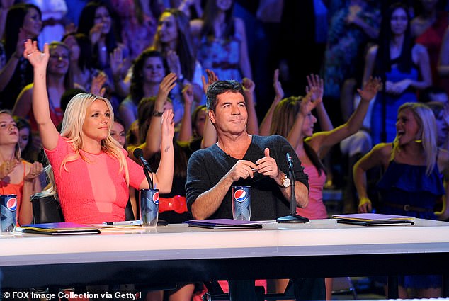 Lol: Martin refused to offer the song to Cowell, while Cowell said: 'I went, "WHO?" And he went, "Britney Spears." I went, "Max, let me give you some advice.  No one will have a hit with the name Britney Spears."'(seen with Spears in 2012 on The X Factor USA)