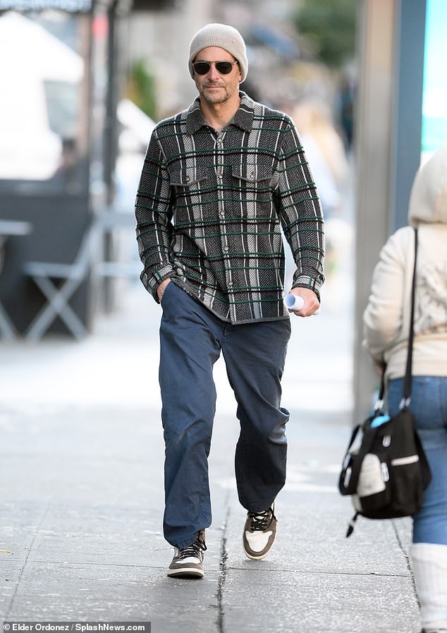 Man of style: With his gray beanie and dark sunglasses, Bradley exuded a cool vibe during his cold outing in the Big Apple last Tuesday