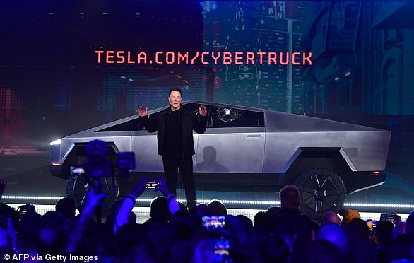 Musk speaks in front of Tesla's recently unveiled all-electric battery-powered Cybertruck with shattered windows, after a failed resistance test, at the Tesla Design Center in Hawthorne, California on November 21, 2019