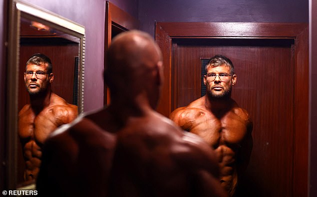 Nick Clark and Dean Smith prepare backstage.  IBFA UK is a non-profit bodybuilding federation