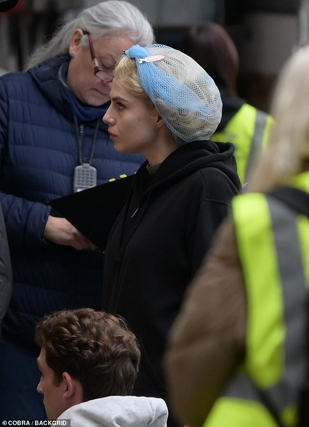 Locks: Her hair was pinned with a blue net