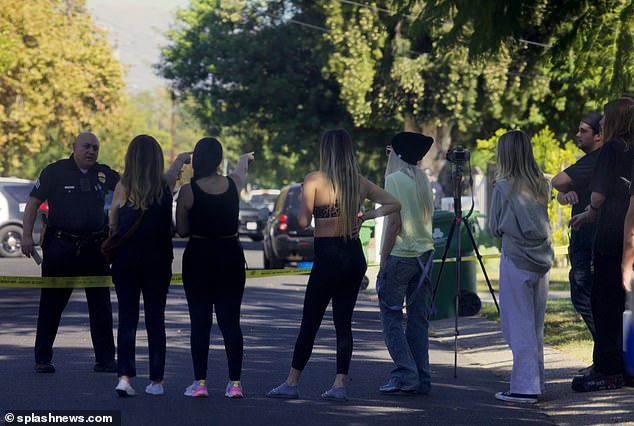 Tori was pictured behind yellow tape during a two-hour standoff that ended with the suspect in custody and no one injured, onlookers said