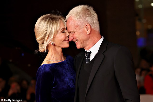 Love: Sting couldn't take his eyes off his beautiful wife, who wore a glamorous blue velvet dress as they cozied up