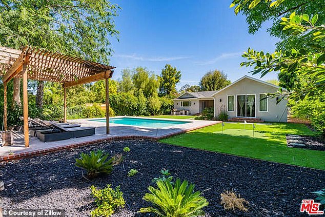 A large swimming pool, with terrace and outdoor space is perfect for cooling off in the warm weather of the San Fernando Valley