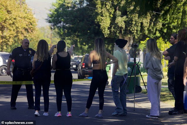 Tori was pictured behind yellow tape during a two-hour standoff that ended with the suspect in custody and no one injured, onlookers said