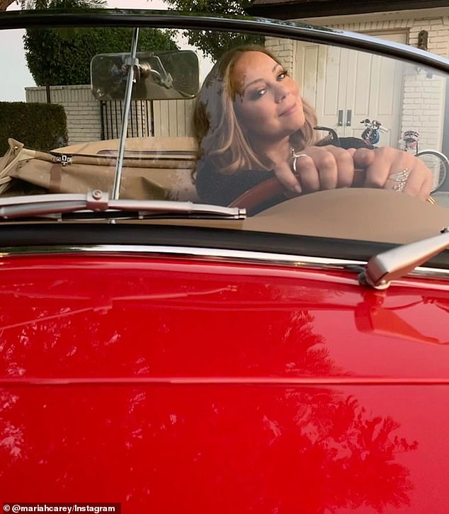 Tribute: The Grammy-winning superstar beamed from behind the wheel as she shared a series of photos showing off the stunning restoration of her father's red speedster