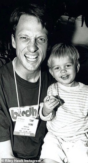 Famous Dad: Riley is pictured with his father Tony Hawk in the 1990s