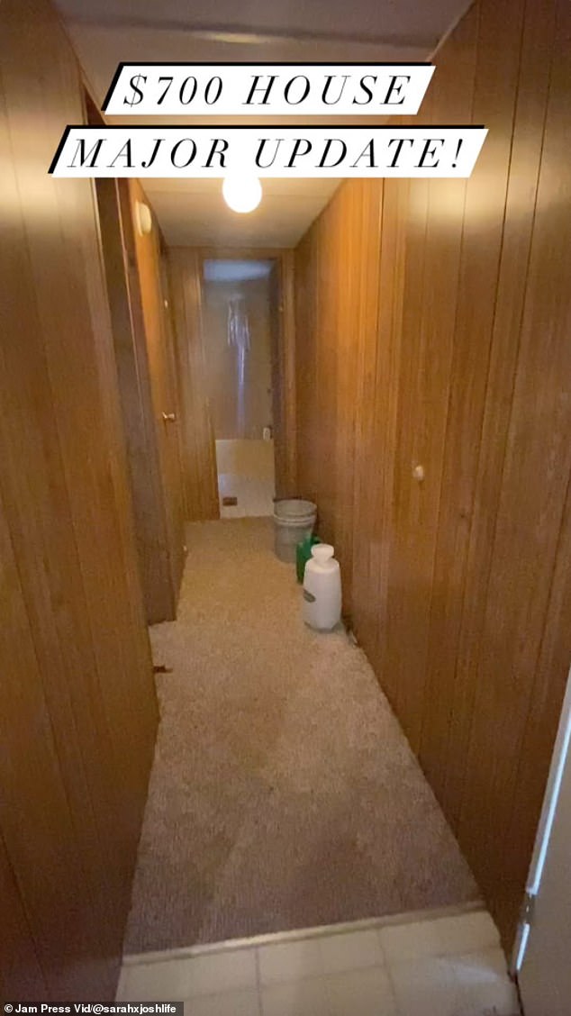 They have spent $300 renovating the house so far.  The photo shows the hallway in their new residence