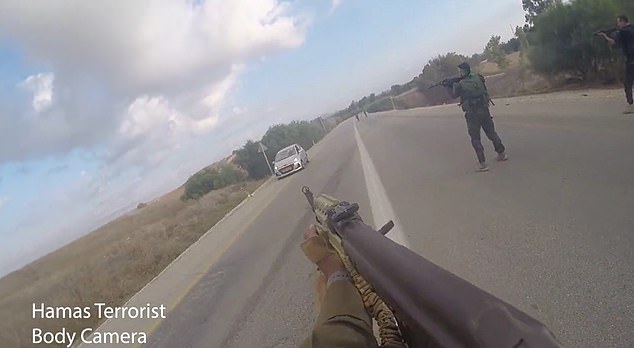 This clip showed the gunman, brandishing his AK-47 assault rifle, ordering two Israelis to drive slowly across the road to stop their car