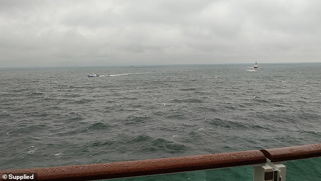 A view from the P&O cruise ship Iona shows the rescue operation underway with several ships on site