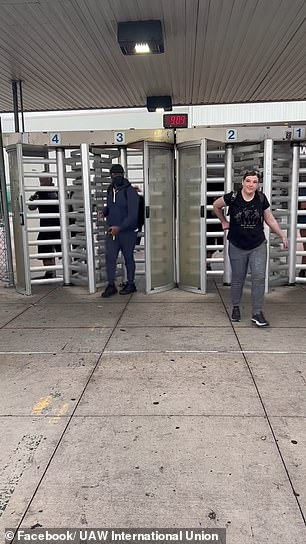 UAW members are seen walking out as they launch a new attack against a highly profitable GM plant in Arlington, Texas