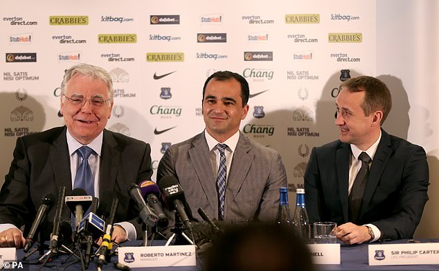 Kenwright was instrumental in the running of Everton and is pictured announcing Roberto Martinez as the club's manager in 2013