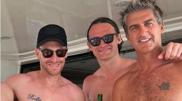 The coach from Melbourne is on a surfing holiday with friends during the off-season