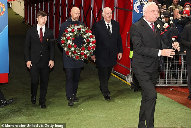 Erik ten Hag led the tributes as he walked out of the tunnel behind a bagpiper while flanked by United's youth team captain Dan Gore (left) and Alex Stepner (right)