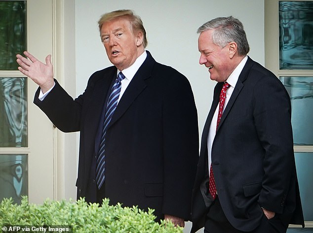 U.S. President Donald Trump walks with Chief of Staff Mark Meadows after returning to the White House from an event at the WWII Memorial in Washington, DC, on May 8, 2020