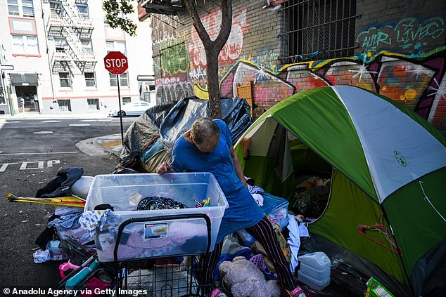 A homeless woman in San Francisco's Tenderloin District.  As of October 22, the city's theft rate has increased by 15.4 percent and motor vehicle theft has increased by 8.9 percent